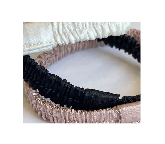 Detail of delicate gathered silk hair ties to protect damaged hair in pink white and black for cute ponytail style