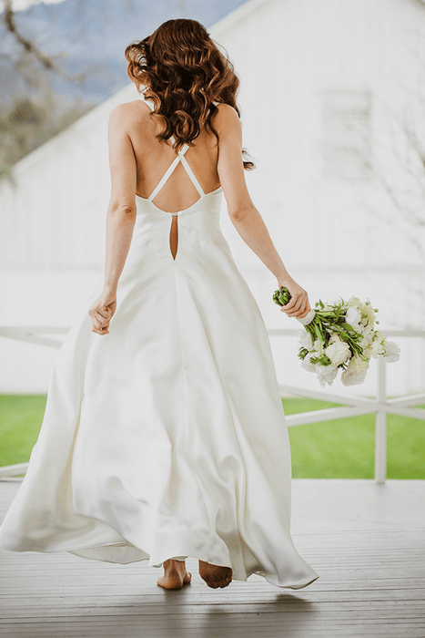 Silk slip wedding dress in bias cut ivory silk with crossover back
