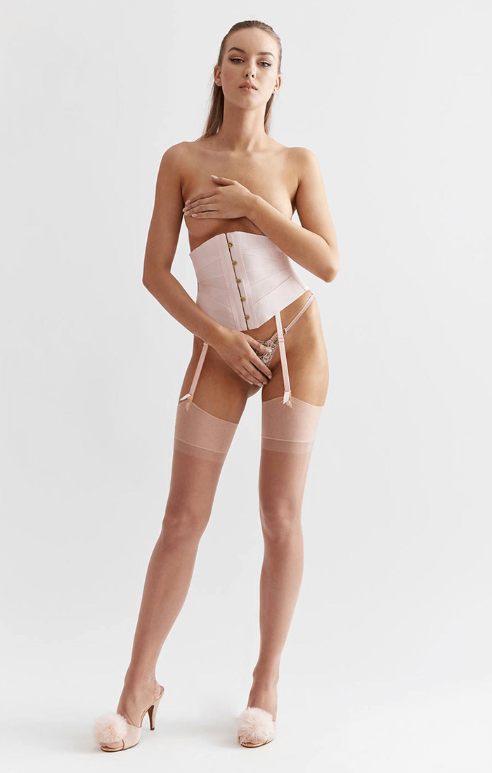 Luxury blush pink ribbon corset with garter straps worn with boudoir feather mules