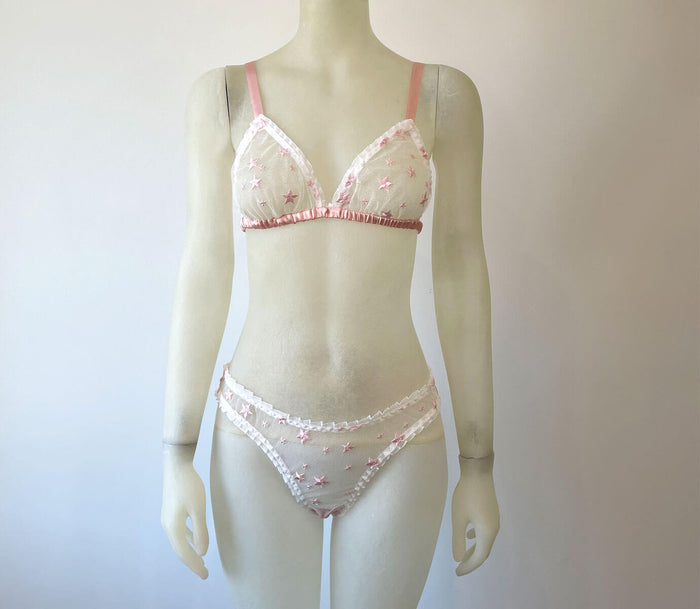 Pink triangle bra bralette and panty set in sheer embroidered lace with pink stars, pink silk and white ruffles for vintage pinup style