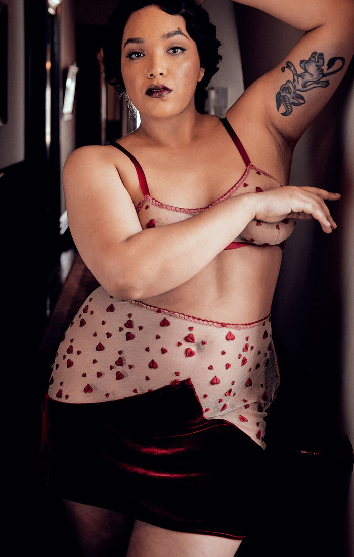 Curvy red half slip with vintage styling made from silk velvet and red heart lace embroidery worn with red bralette