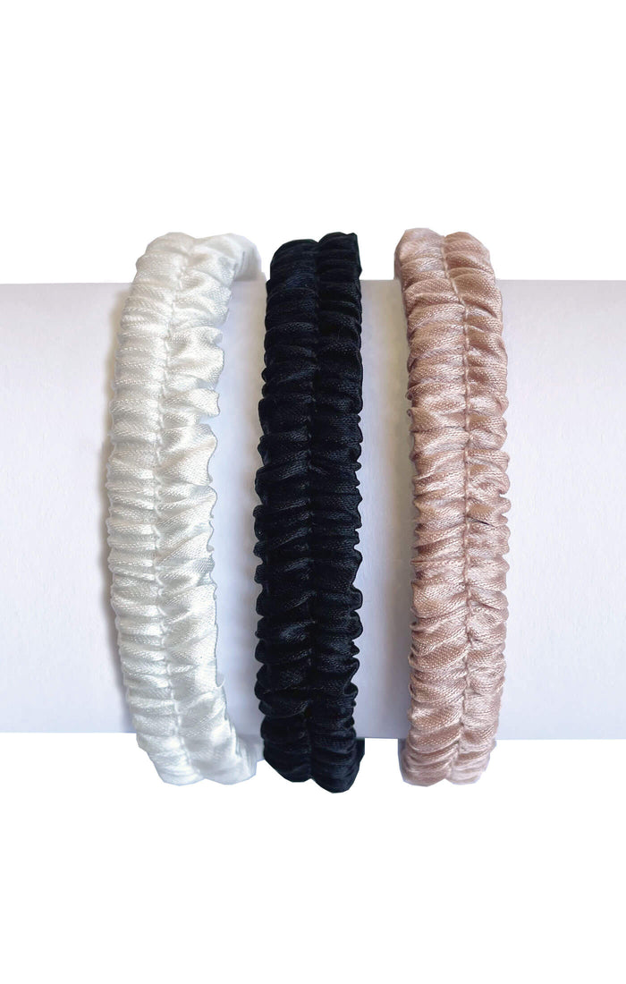 Three silk covered hair ties to protect textured, delicate, curly, or color treated hair in neutral colors white pink and black for casual spa style